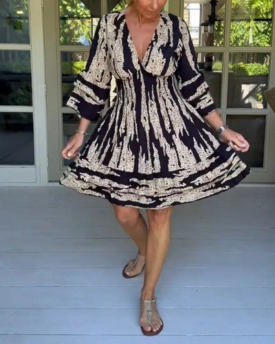 Vestido con escote en V y mangas tres cuartos